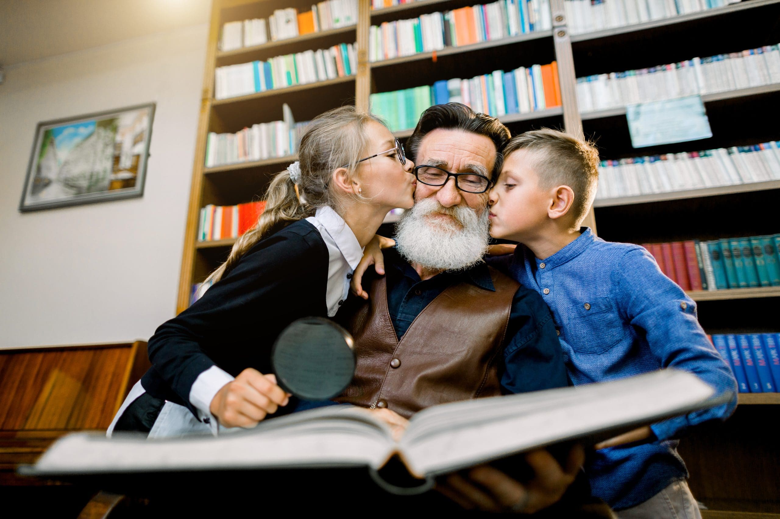 a grandfather with two young grandchildren